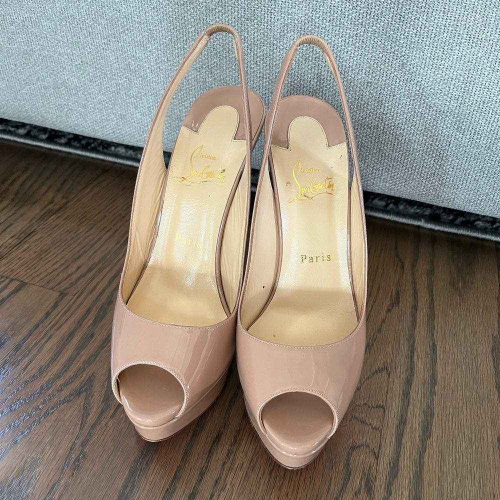 Christian Louboutin Nude Peep Toe Slingback Heels
Only worn three times